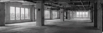 Empty, unfinished concrete floor before the fitness build